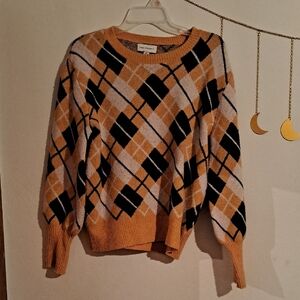Free Assembley Women's Argyle Sweater - Black, White, and Mustard Yellow.